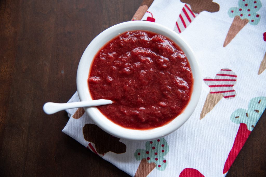 Healthy strawberry syrup made with frozen strawberries and chia seed in a bowl